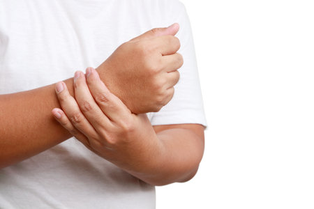 Fat man wearing a white shirt, right wrist pain. Health concept. Disease of obese people. white backgroundの写真素材