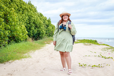 Asian fat female tourists travel nature mangrove forest. Concept of nature conservation. Ecotourism.の写真素材