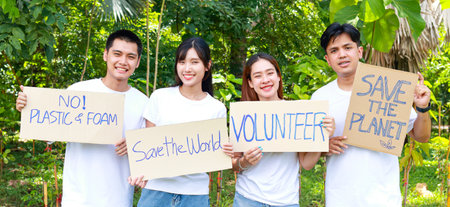Group of young Asian volunteers holding signs supporting nature and the environment. Social volunteer concept. world environment dayの写真素材