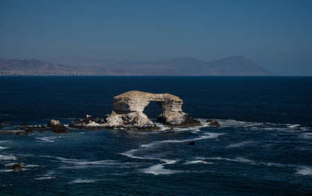 Natural arch rock formation La Portada in pacific ocean near coast of Antofagasta Chile South...