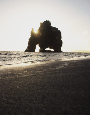 Panoramic sunrise view of Hvitserkur dragon rock formation petrified basalt sea stack Vatnsnes Peninsula Icelandの写真素材
