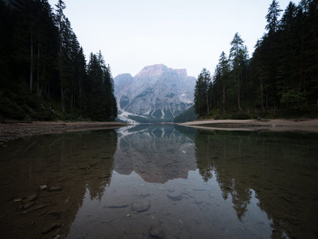 Panorama reflection boat house of Lago di Braies Pragser Wildsee alpine mountain lake Dolomites alps...