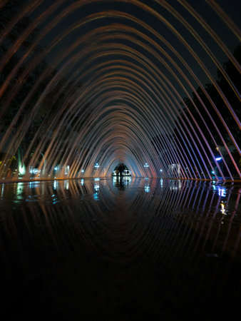 Colorful illuminated water fountain tunnel art installation Circuito magico del Agua in Parque de la Reserva Lima Peruの写真素材
