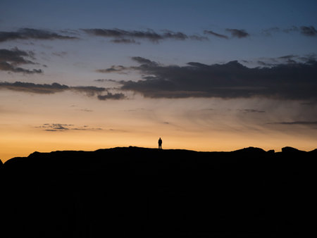 Sunset panorama of hiker on Marcahuasi andes plateau rock formations mountain hill valley nature landscape Lima Peruの写真素材