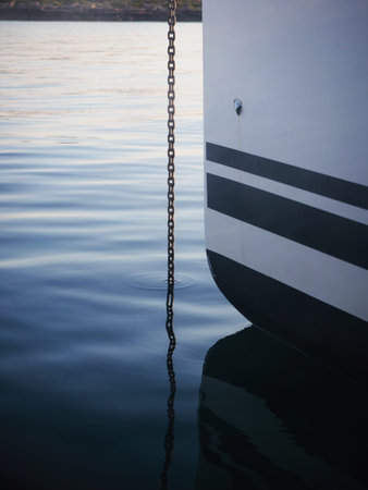 Closeup detail of anchor rope metal chain in calm water mediterranean sea Mallorca Majorca Balearic Islands Spain Europeの写真素材