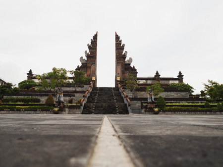 Panorama view of typical traditional balinese gate at Ngurah Rai Airport welcome sign Bali Indonesia Asiaの写真素材