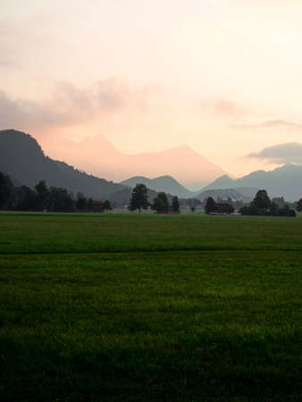 Panorama view of old historic baroque alpine mountain chapel church St. Coloman at Schwangau Allgaeu...