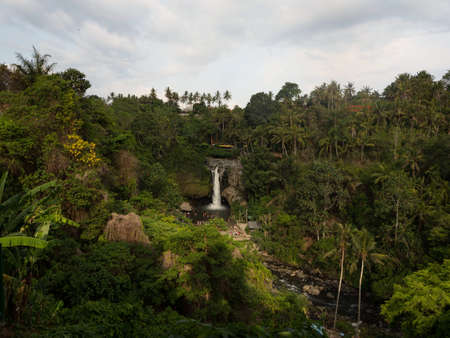 Panorama landscape view of Tegenungan waterfall river cataract Gianyar Ubud Denpasar Bali Indonesia South East Asiaの写真素材