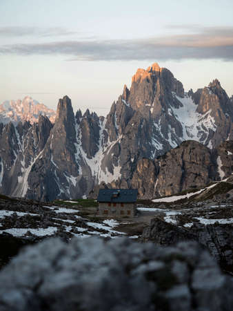 Alpine panorama of rifugio Lavaredo infront of Cadini di Misurina mountain range group seen from Tre Cime peak summit in Sexten Dolomites Belluno, South Tyrol Italy alps Europeの写真素材