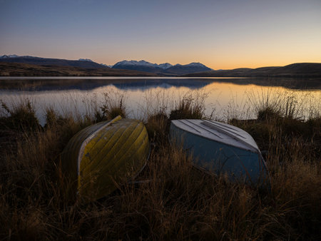 Upside down fishing boats at Lake Alexandrina, idyllic calm serene tranquil early morning golden...