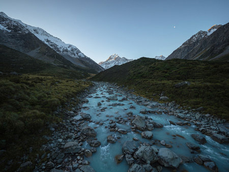Alpine nature landscape panorama view of the Hooker Valley Track snow covered mountains, green...