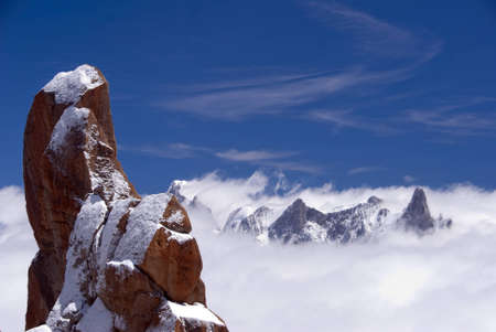 Mont Blanc as seen form the Aguille du Midi staion in summer, showing rocks, snow and high mountain landscapeの写真素材