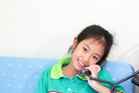 Girl talking on the phone with her father