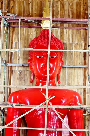 Restored. Before the golden statues of Buddhaの写真素材