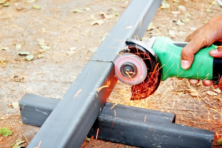 Small grinder cutting steel by handの写真素材