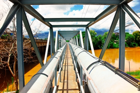 Industry water supply pipeline crossing the riverの写真素材