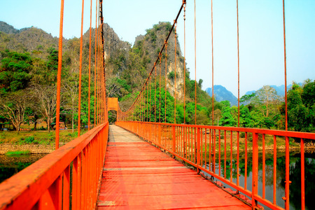 Red bridge in Vang vieng,Laosの写真素材