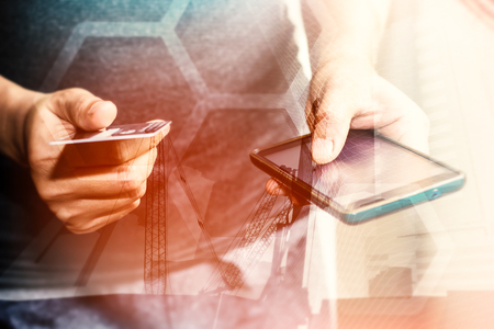 Young woman using her smartphone connecting scene technology backgroundの写真素材
