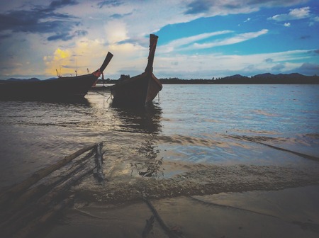 Fishing boat on the beach seascape nature backgroundの写真素材