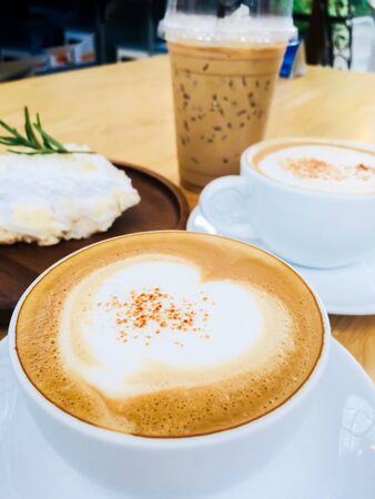 Close up white cup coffee on wood table scene food and beverage backgroundsの写真素材