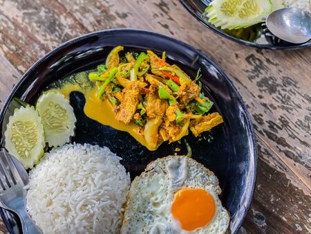 Fried rice with pork spicy on wood table food and drink backgroundsの写真素材
