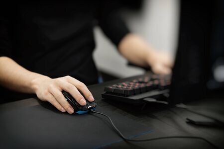 the hand of a man playing a computer gameの写真素材