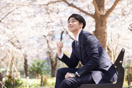 Japanese male businessman in guts poseの写真素材