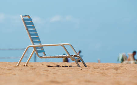 Beach chair on the sandy beachの写真素材