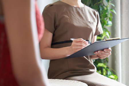 Female esthetician counseling at beauty salon
