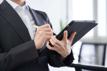 Japanese female businesswoman interviewing in the officeの販売画像