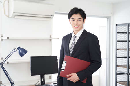 Japanese man real estate sales person who guides the houseの写真素材