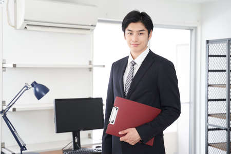 Japanese man real estate sales person who guides the houseの写真素材