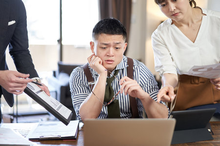 Asian male businessman chasing work and deadlineの写真素材