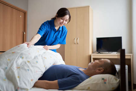 Female caregiver working in a nursing homeの写真素材