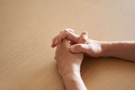 The hand of the elderly who worry