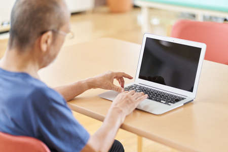 Elderly people using personal computers in nursing homes