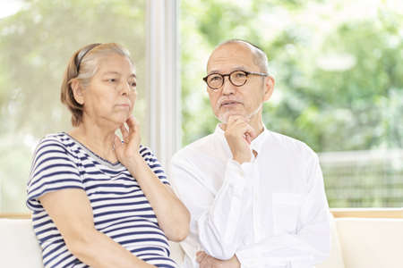 Elderly couple worried about old ageの写真素材