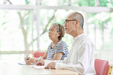 Elderly couple attending inheritance seminarの写真素材