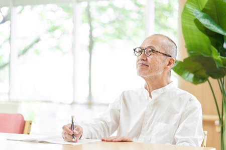 Elderly people writingの写真素材