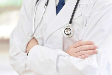 A male doctor with arm folds