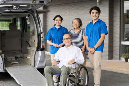 Wheelchair riding elderly and caregivers