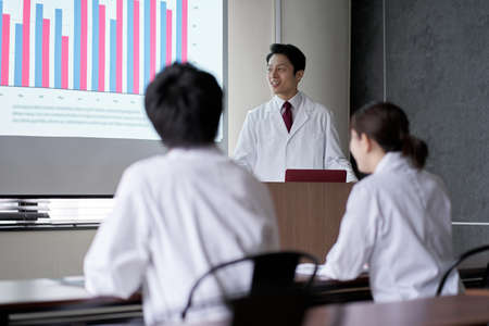 Medical personnel taking the stage at the seminarの写真素材