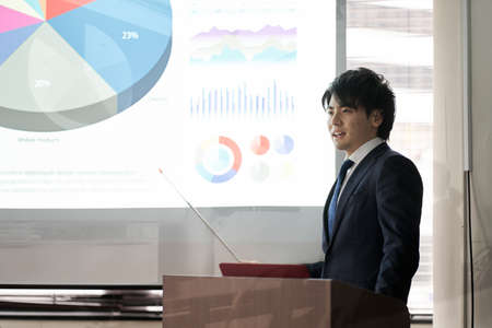 Asian businessman giving a presentation at a conference