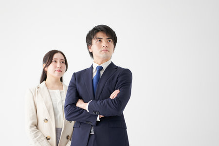 Asian business person standing on a white backgroundの写真素材
