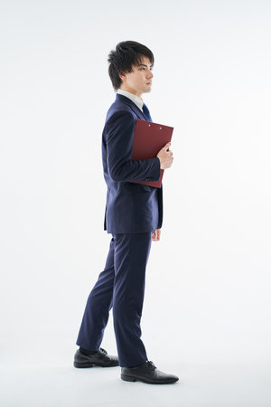 Asian man posing on white backgroundの写真素材