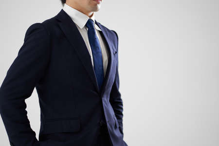 Asian man posing on gray backgroundの写真素材