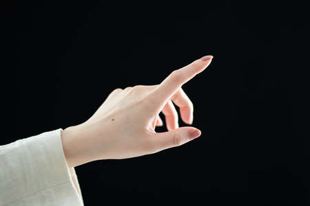 Close-up of the hand of a woman pointingの写真素材