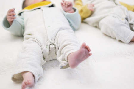 Asian baby fluttering his feet