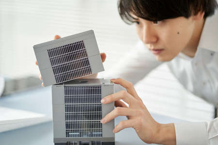 Asian businessman thinking about the layout of a commercial building
