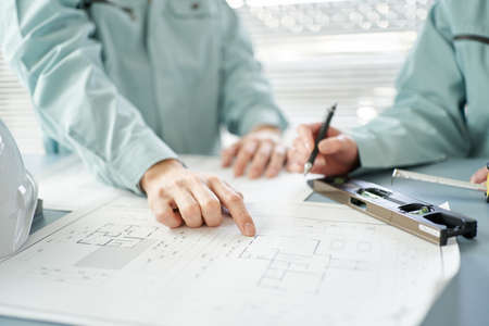 Asian workers having an architectural meeting
